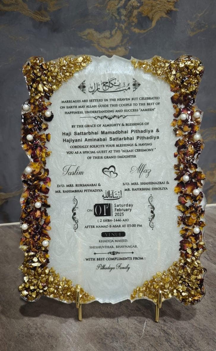 Custom Islamic Nikah invitation plaque with Arabic-English text, gold resin detailing, floral borders, and pearl embellishments on an ornate stand.