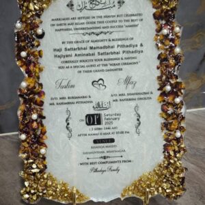 Custom Islamic Nikah invitation plaque with Arabic-English text, gold resin detailing, floral borders, and pearl embellishments on an ornate stand.